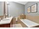 Bright bathroom with a sleek, white tub and modern fixtures, plus stylish decor at 111 N 12Th St # 1426, Tampa, FL 33602