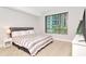 Serene bedroom with a large window, a plush bed, and modern furnishings at 111 N 12Th St # 1426, Tampa, FL 33602