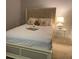 Cozy bedroom with a queen bed, decorative pillows, a lamp, and neutral decor at 111 N 12Th St # 1426, Tampa, FL 33602