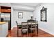Dining room with table, chairs, decorative mirror, and view of kitchen with stainless steel refrigerator at 111 N 12Th St # 1426, Tampa, FL 33602