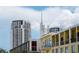A mix of low and high rise condominiums with various exteriors and balconies in a vibrant, sunny community at 111 N 12Th St # 1426, Tampa, FL 33602