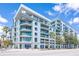A modern condo building featuring stylish architecture, balconies, and lush landscaping at 111 N 12Th St # 1426, Tampa, FL 33602