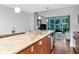 Granite kitchen island with stainless steel sink and dishwasher in an open living space at 111 N 12Th St # 1426, Tampa, FL 33602