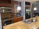 Modern kitchen with stainless steel appliances, granite countertops and wood cabinetry at 111 N 12Th St # 1426, Tampa, FL 33602