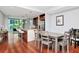 Open floor plan featuring dining area, kitchen with island and barstool seating, and a sliding glass door to a balcony at 111 N 12Th St # 1426, Tampa, FL 33602