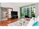 Open-concept living area with sliding doors leading to a balcony and a view of the city at 111 N 12Th St # 1426, Tampa, FL 33602
