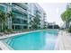 Inviting pool area with lounge chairs and palm trees outside this modern building at 111 N 12Th St # 1426, Tampa, FL 33602