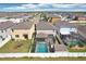 Aerial view of homes, showcasing backyard pools, screened enclosures, and neighborhood layout at 11301 Hudson Hills Ln, Riverview, FL 33579