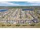 Beautiful aerial shot of a neighborhood featuring modern homes, lakes, and community amenities at 11301 Hudson Hills Ln, Riverview, FL 33579