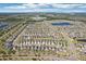 Wide aerial view of a sprawling residential area with ponds, green spaces, and organized street layouts at 11301 Hudson Hills Ln, Riverview, FL 33579