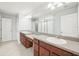 Bathroom featuring double sinks and a large mirror at 11301 Hudson Hills Ln, Riverview, FL 33579