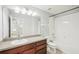 Bathroom featuring a single vanity, a shower-tub combo and tiled flooring at 11301 Hudson Hills Ln, Riverview, FL 33579