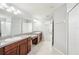 Bright bathroom features a double vanity and tiled floors at 11301 Hudson Hills Ln, Riverview, FL 33579