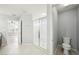 Bright bathroom featuring a glass enclosed shower and separate toilet room at 11301 Hudson Hills Ln, Riverview, FL 33579