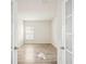 Bedroom with natural light and wood-look vinyl flooring at 11301 Hudson Hills Ln, Riverview, FL 33579