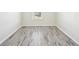 Bedroom with neutral paint and luxury vinyl plank flooring at 11301 Hudson Hills Ln, Riverview, FL 33579
