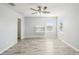 Bedroom with vinyl flooring, ceiling fan, and study nook at 11301 Hudson Hills Ln, Riverview, FL 33579