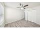 Bedroom with vinyl flooring, ceiling fan, and closet at 11301 Hudson Hills Ln, Riverview, FL 33579