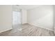 Bright bedroom featuring wood-look floors and natural light at 11301 Hudson Hills Ln, Riverview, FL 33579
