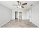 Spacious bedroom featuring wood-look flooring and a ceiling fan at 11301 Hudson Hills Ln, Riverview, FL 33579