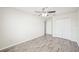 A neutral bedroom showcases modern vinyl flooring and closet space at 11301 Hudson Hills Ln, Riverview, FL 33579