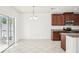 Bright dining area with sliding glass doors leading to a screened-in patio at 11301 Hudson Hills Ln, Riverview, FL 33579