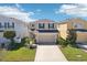 Charming two-story home with a well-maintained lawn and attached two-car garage at 11301 Hudson Hills Ln, Riverview, FL 33579