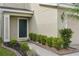 Inviting front entrance with manicured landscaping and a dark green front door at 11301 Hudson Hills Ln, Riverview, FL 33579