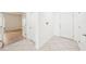 Hallway showing neutral tile floors and white doors at 11301 Hudson Hills Ln, Riverview, FL 33579