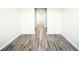Hallway with modern vinyl flooring and white walls and trim at 11301 Hudson Hills Ln, Riverview, FL 33579