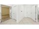 Hallway showing neutral tile floors and white doors at 11301 Hudson Hills Ln, Riverview, FL 33579