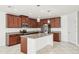 Bright kitchen features granite counters, stainless appliances, and a large center island at 11301 Hudson Hills Ln, Riverview, FL 33579