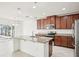 Open concept kitchen features granite countertops, island, and stainless steel appliances at 11301 Hudson Hills Ln, Riverview, FL 33579