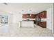 Open kitchen flows to the living area and features granite countertops and stainless appliances at 11301 Hudson Hills Ln, Riverview, FL 33579