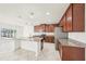 Kitchen with granite countertops, stainless steel appliances, and a view to the pool area at 11301 Hudson Hills Ln, Riverview, FL 33579