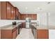 Spacious kitchen with ample wood cabinets, granite countertops, and stainless steel appliances at 11301 Hudson Hills Ln, Riverview, FL 33579