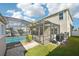 Screened-in patio area showcasing a sparkling in-ground pool and outdoor space for relaxation at 11301 Hudson Hills Ln, Riverview, FL 33579