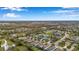 Beautiful aerial of homes in a planned community near tranquil pond and tree-filled green spaces at 11822 Crawford Parrish Ln, Parrish, FL 34219