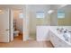 Tiled bathroom with walk-in shower, and a large mirror above the vanity at 11822 Crawford Parrish Ln, Parrish, FL 34219