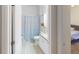 Clean bathroom with a shower-tub combo and white vanity, conveniently located near the bedroom at 11822 Crawford Parrish Ln, Parrish, FL 34219