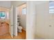 Bright bathroom featuring a tiled shower and a separate toilet room for added convenience at 11822 Crawford Parrish Ln, Parrish, FL 34219