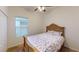 Bedroom showcasing natural light, a comfortable bed, and generous closet space at 11822 Crawford Parrish Ln, Parrish, FL 34219