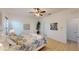 Bright bedroom features a ceiling fan and plenty of natural light at 11822 Crawford Parrish Ln, Parrish, FL 34219