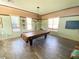 Spacious game room with a pool table and stylish decor for entertainment at 11822 Crawford Parrish Ln, Parrish, FL 34219