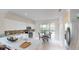 Modern kitchen with white cabinets, stainless steel appliances, and tile backsplash at 11822 Crawford Parrish Ln, Parrish, FL 34219