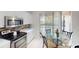 Bright kitchen with stainless steel appliances and sliding doors to the patio at 11822 Crawford Parrish Ln, Parrish, FL 34219