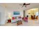 Inviting living area with ample seating, elegant decor, and seamless flow into the dining space, perfect for entertaining at 11822 Crawford Parrish Ln, Parrish, FL 34219