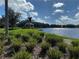 Serene community pond with a gazebo, surrounded by lush greenery, perfect for relaxation at 11822 Crawford Parrish Ln, Parrish, FL 34219