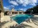 Beautiful community pool with crystal clear water and plenty of lounge seating at 11822 Crawford Parrish Ln, Parrish, FL 34219
