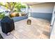 Rear patio with grilling area, fire pit, and privacy fencing offers tranquil outdoor area at 13116 Sheridan Dr, Hudson, FL 34667